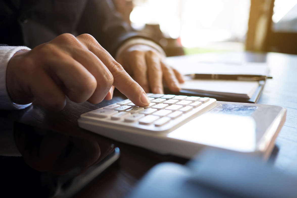 Businessmen calculate investment expansion business, saving mone